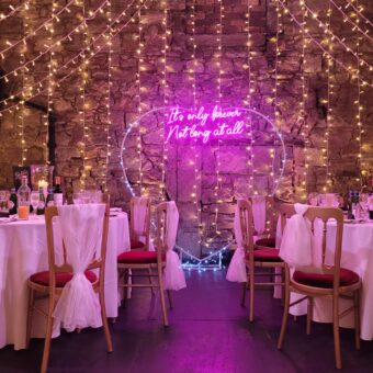Round Dinner Tables with White Linen for a Dinner at The Caves, Edinburgh, with Additional Fairy Lights. A Wedding to Remember!