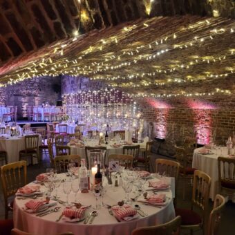 Round Dinner Tables with White Linen for a Dinner at The Caves, Edinburgh.